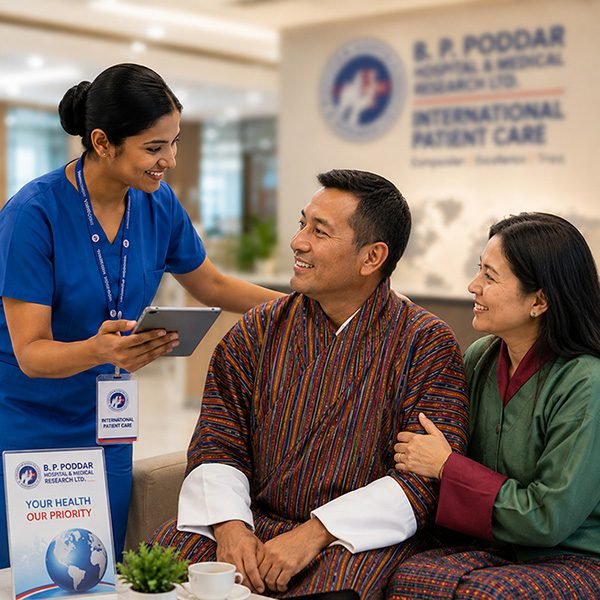 A coordinator from the international patient desk talking with a patient and his wife
